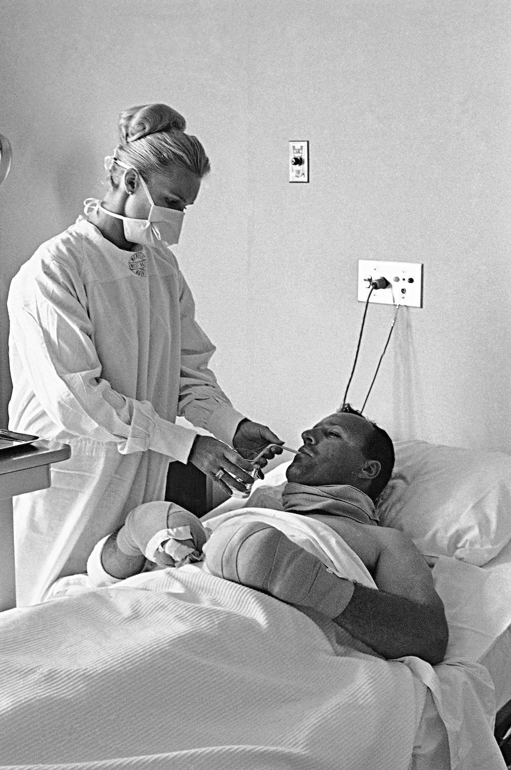 Lucy Foyt tending A.J. Foyt at Riverside Hospital in 1965