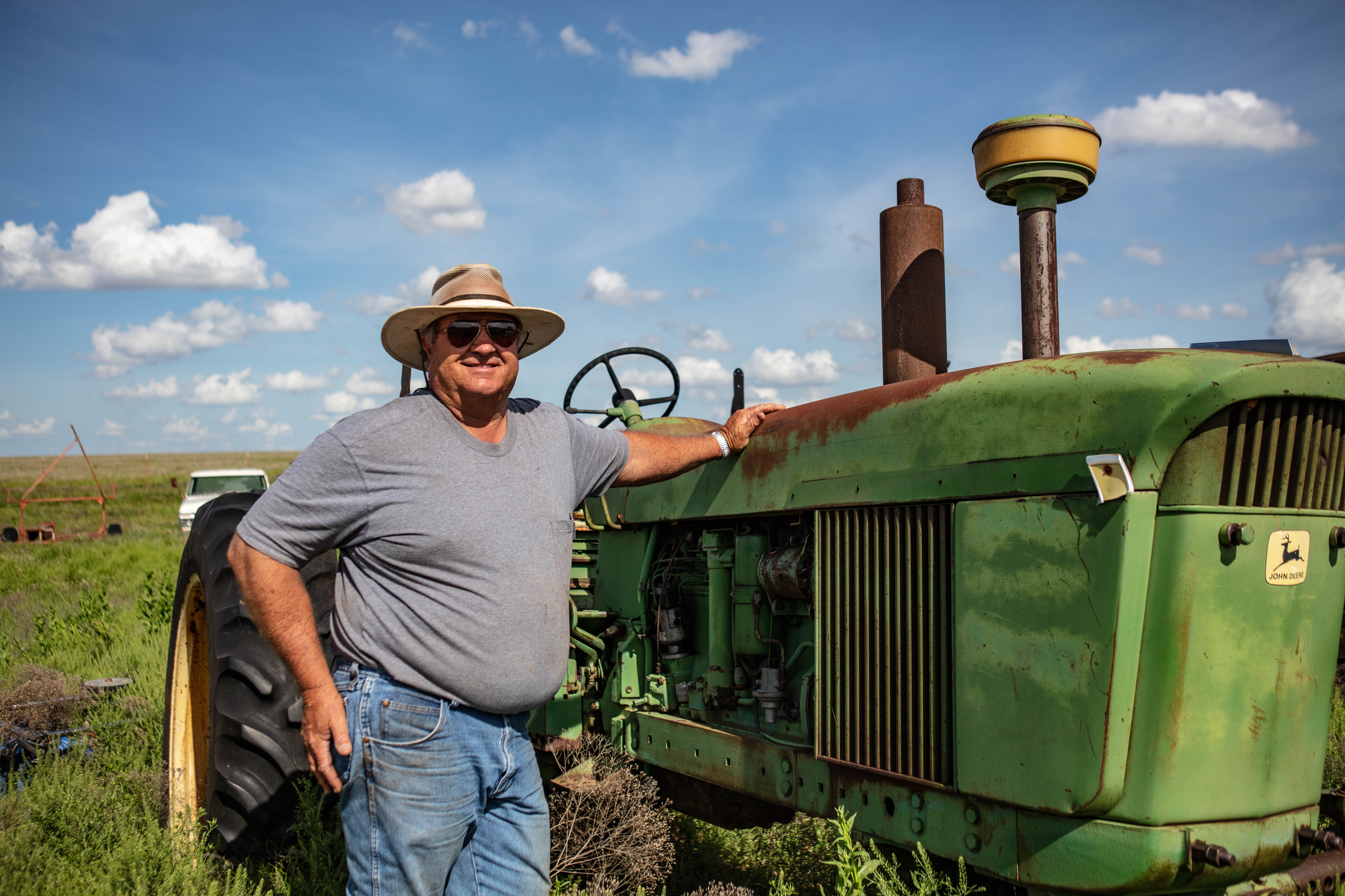 chris hunt poses with his tractor