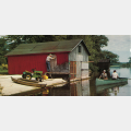 John Deere lawn mower and canoe on old cabin